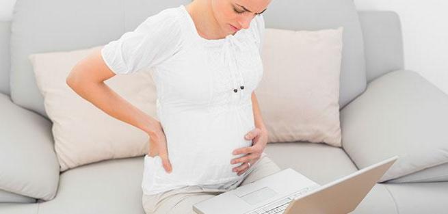Болит спина во время беременности